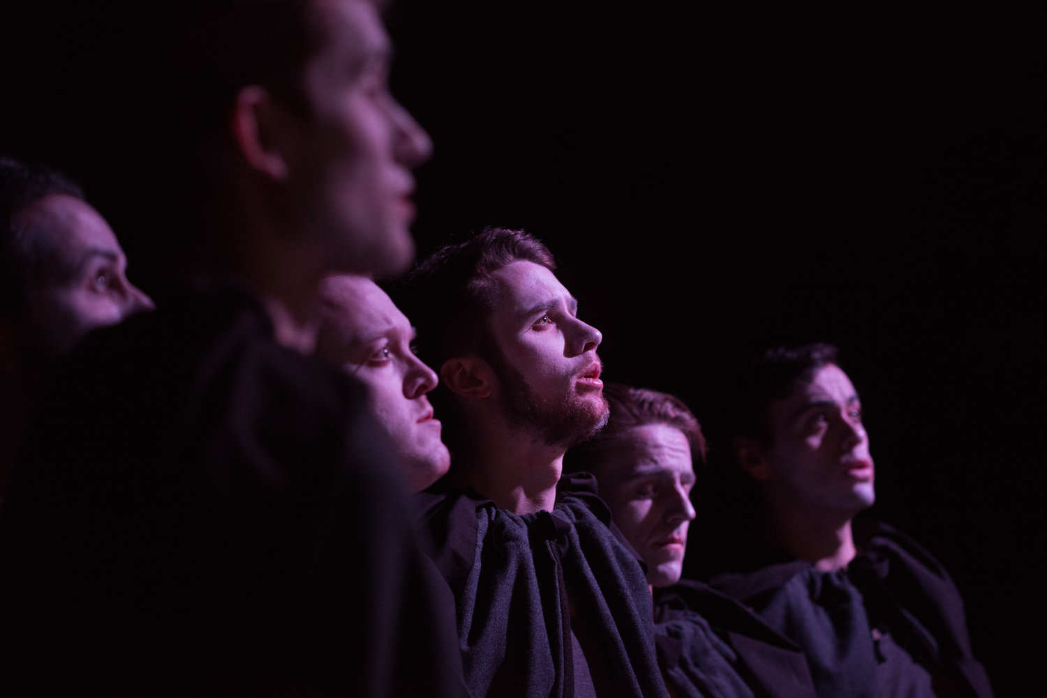 a close-up on the faces of the performers