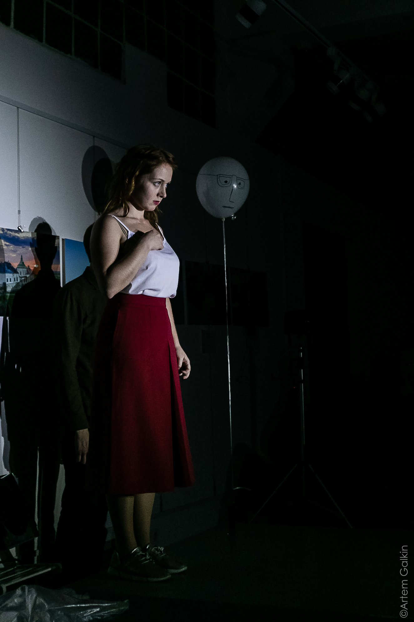 a woman stands alone with a balloon in a new Ukrainian play