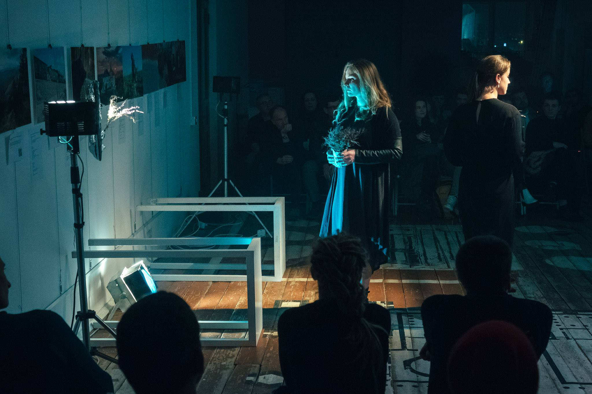 a woman lays flowers in a new Ukrainian play